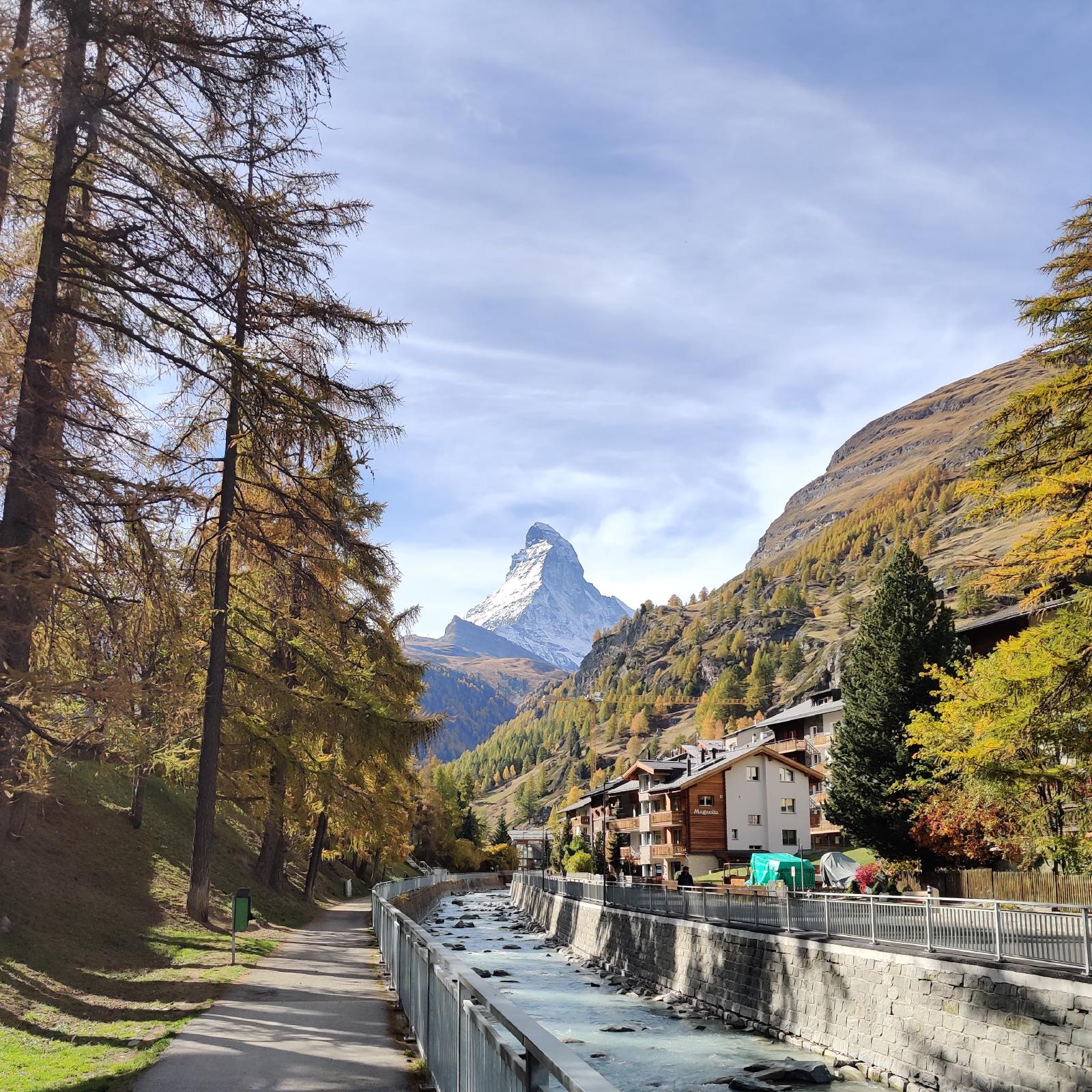 Taken looking South in Zermatt with the river in the foreground and the Matterhorn in the background during fall