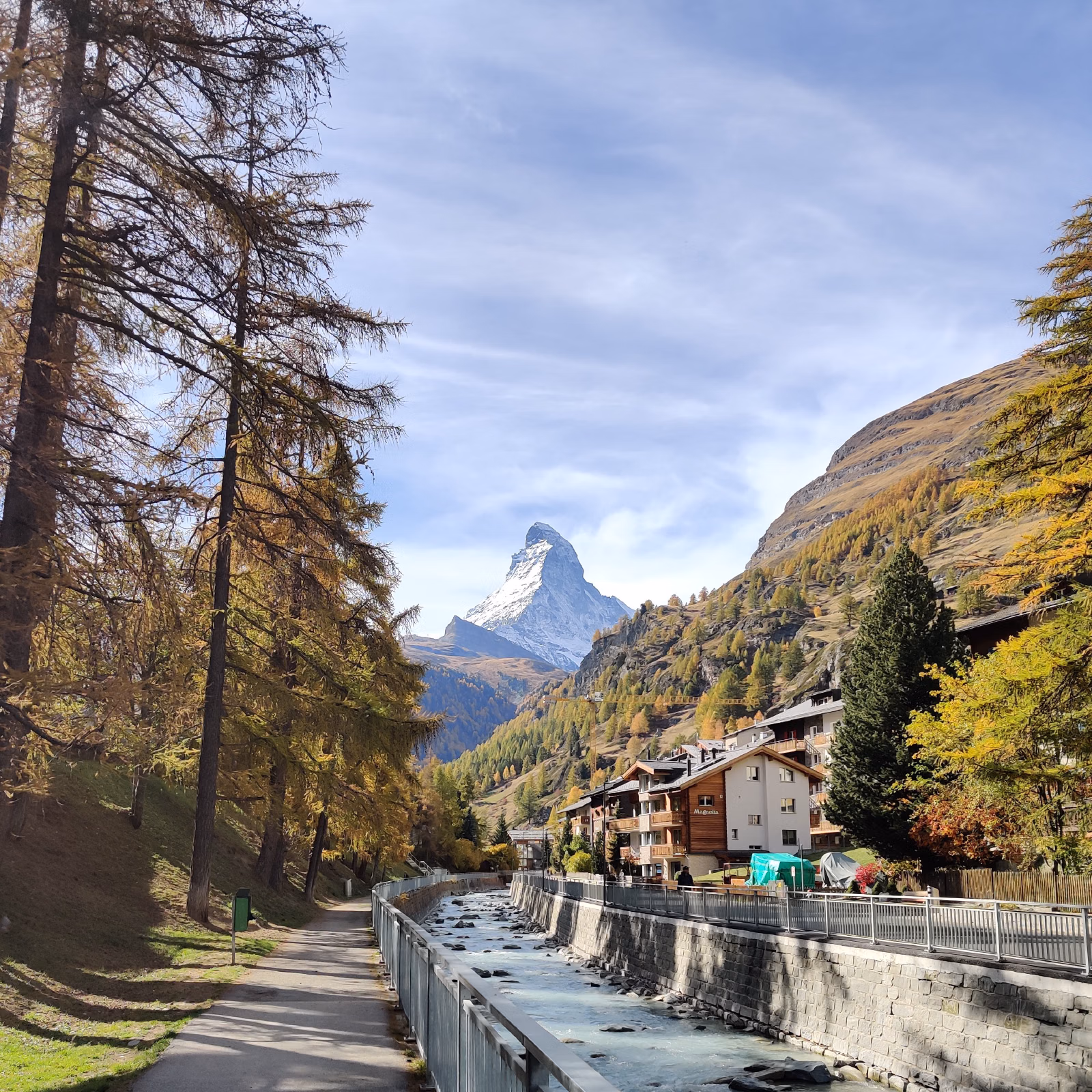 Taken looking South in Zermatt with the river in the foreground and the Matterhorn in the background during fall